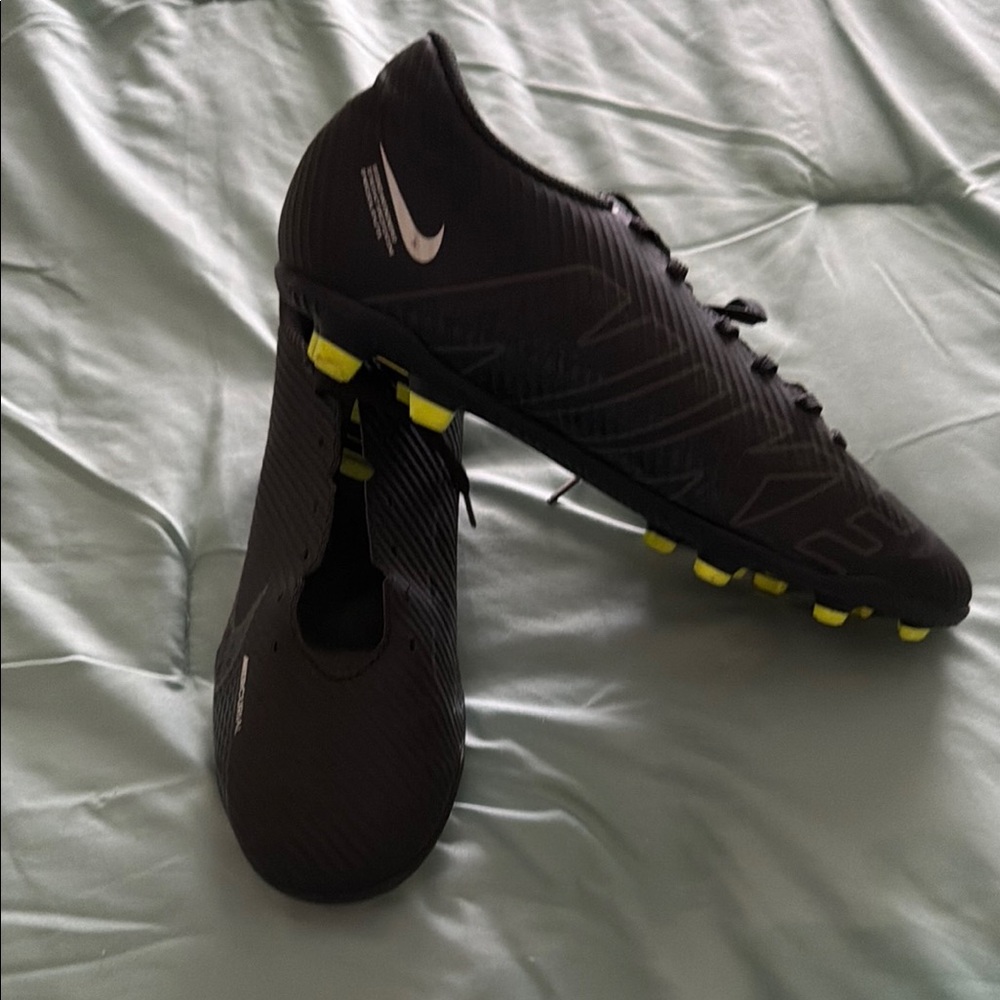 Nike boys Black Soccer Cleats with Yellow Studs